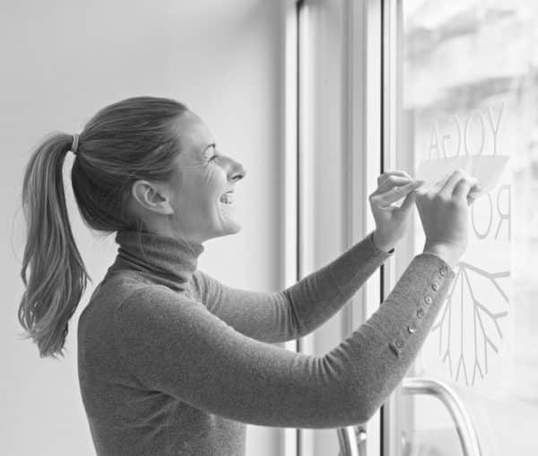 Woman applying decal